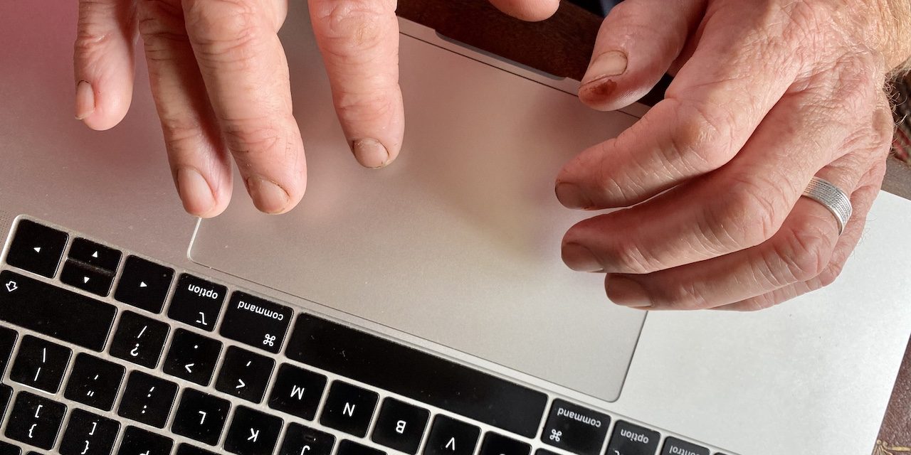Farmer’s hands on keyboard ready to attend virtual event