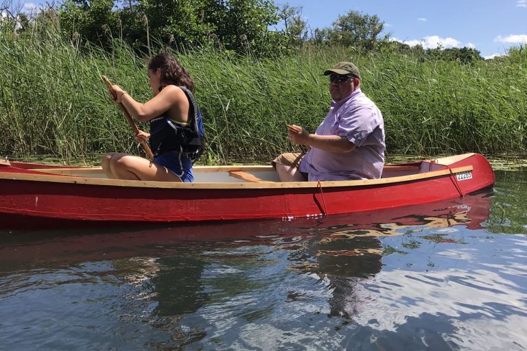 Farmer in canoe